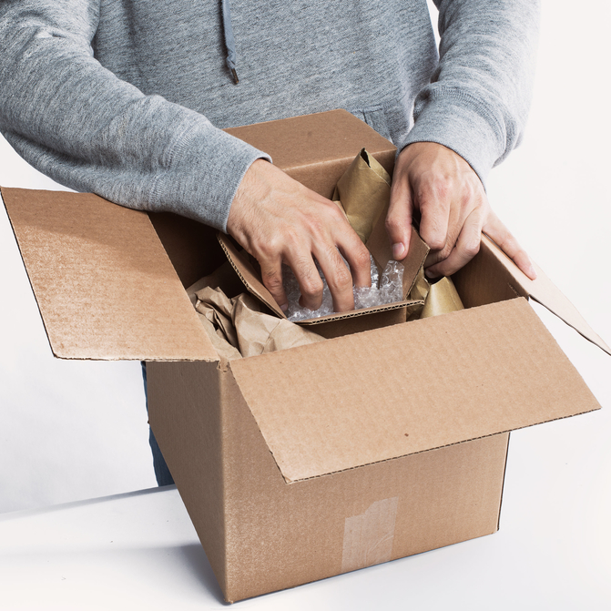 A person packing a package